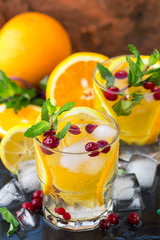 Lemonade - a refreshing drink made of citrus and berries with mint and ice. Selective focus
