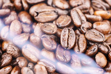 Coffee beans from the roaster with the smoke