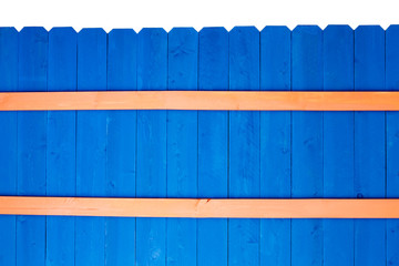 Colorful bright blue stained wooden picket fence