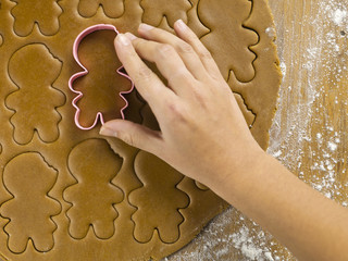 close-up shot of person holding cookie cutter.
