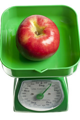 apple on a weighing scale