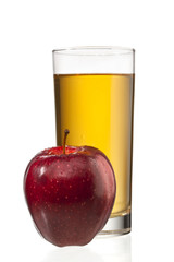 apple beside apple juice glass.