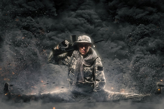 Special forces soldier man with Machine gun on a  dark background