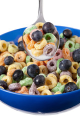 colorful cereal with blueberries and milk