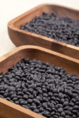 black beans in wooden container