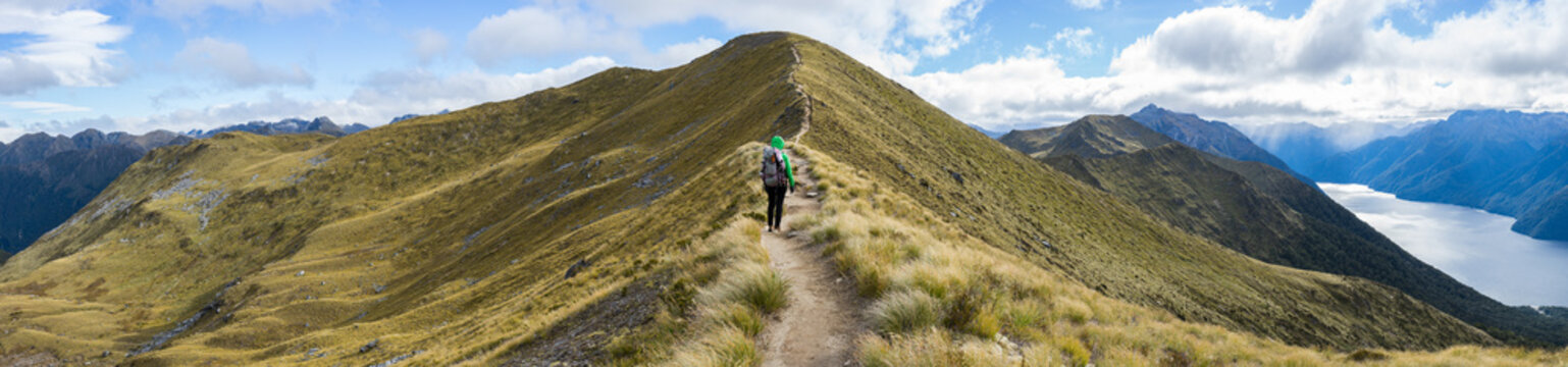 Woman hiker walking on an alpine section of the Kepler Track