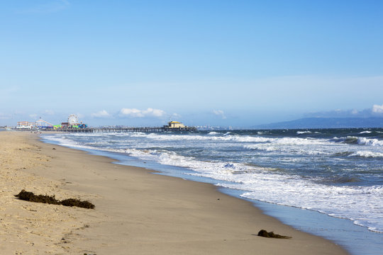 The Pacific ocean and a clear day, Santa Monica. Beach landscape in the USA with blue sea and mountain ranges. 