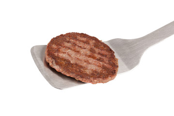 grilled patty on a spatula