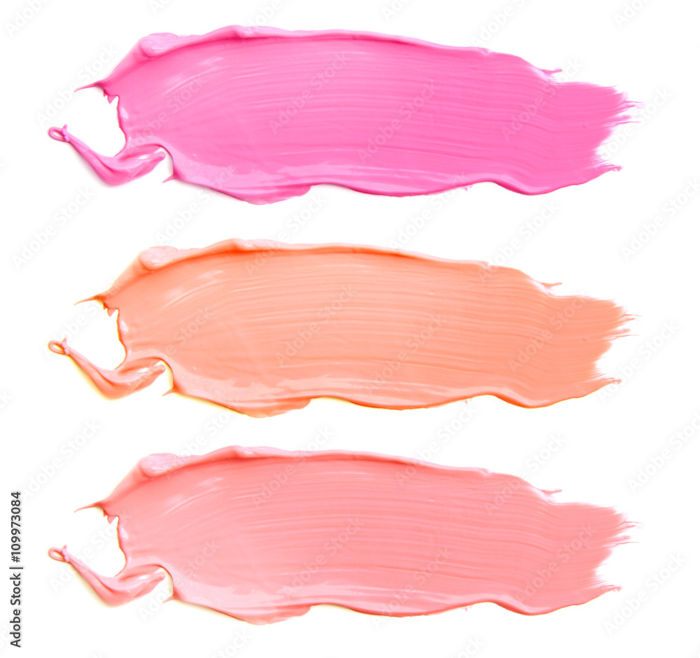 Wall mural texture of the lipstick of different colors isolated on white background. Set of multicolored strokes. Cosmetic product.