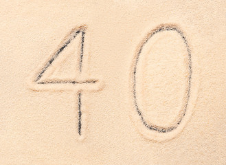 40 number written on beach sand