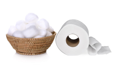 Cotton swabs in basket and toilet paper isolated on white backgr