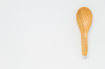 Classic wooden spoon with white background and selective focus