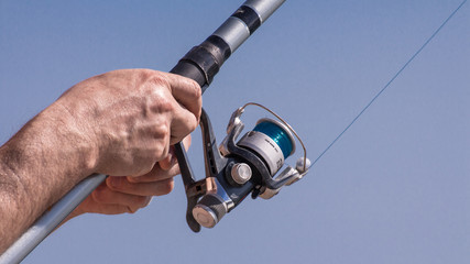holding a fishing pole