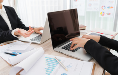 Fototapeta premium Business people using laptop and Financial charts at meeting o