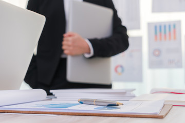 Business people using laptop  and Financial charts  at meeting o