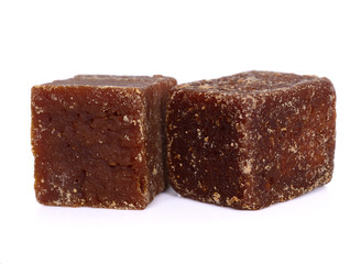  coconut flower sugar blocks on white background.