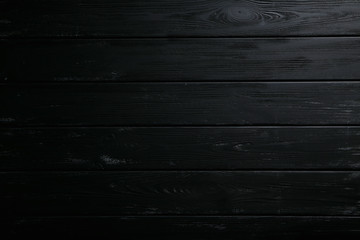 Black wooden background, close up