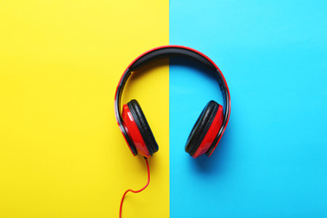 Headphones on a colorful paper background, close up