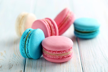 Tasty french macarons on a blue wooden table