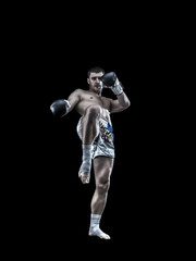 Fototapeta na wymiar Young thai boxing fighter isolated on black background