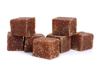 coconut flower sugar blocks on white background.