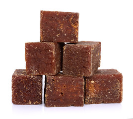 coconut flower sugar blocks on white background.