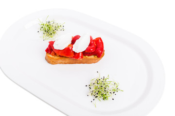 Bruschetta with stewed peppers and mascarpone cheese.