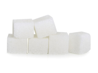 Cubes of sugar on white background