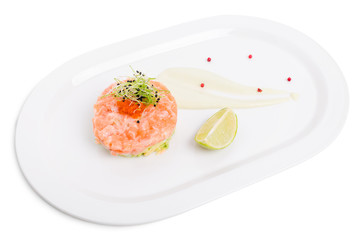 Salmon tartare with avocado and red caviar.