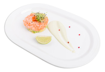 Salmon tartare with avocado and red caviar.