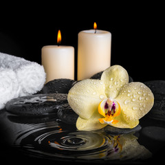 spa background of yellow orchid (phalaenopsis) on zen stones, dr