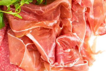 Delicious italian dried meat with arugula.