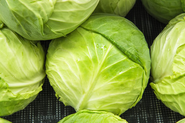 Fototapeta premium fresh cabbage from market shelves real with flaws and bruises