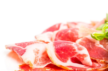 Delicious italian dried meat with arugula.