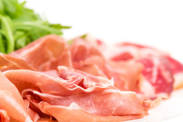 Delicious italian dried meat with arugula.