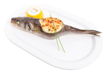 Baked sea bass with seafood and cheese.