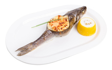Baked sea bass with seafood and cheese.