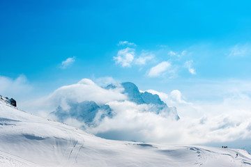 beautiful winter landscape of Dombaj with blue sky, clouds and d