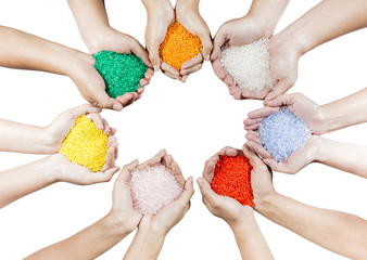 Colored plastic beads on hands