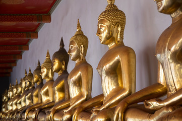 Golden Buddha sculptures in Wat Pho