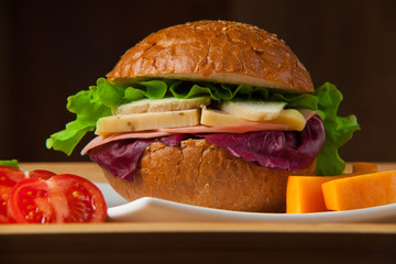 Sandwich with chicken, cheese and salad. Healthy fast food.