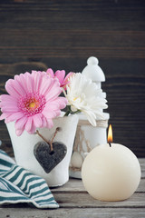 Fototapeta na wymiar Spring flowers in vase on wooden table