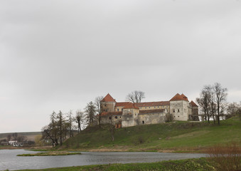 Fototapeta na wymiar Svirzh castle by the lake. Western Ukraine