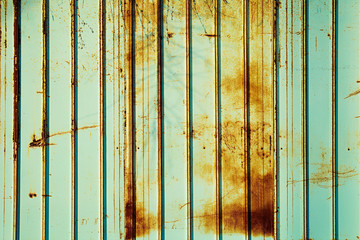 Rusty fence mint color. Mint color background. Rusty metal panel.