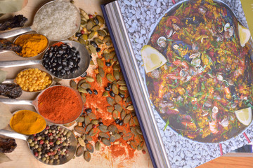 Various colorful spices on wooden table