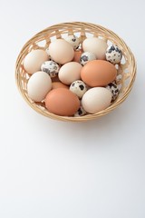 A group of eggs in the basket on white background
