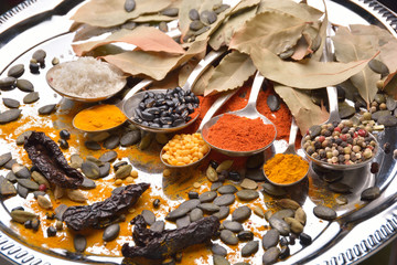 Various colorful spices on wooden table
