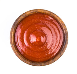  Wood bowl of ketchup isolated on white background. Top view