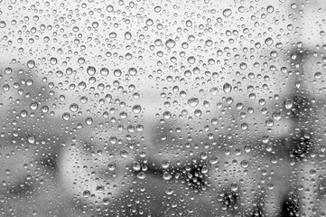 Naklejka na ściany i meble Rain drops on glass