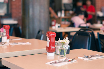 A Table in a Fast Food Cafe Served with a Ketchup Bottle